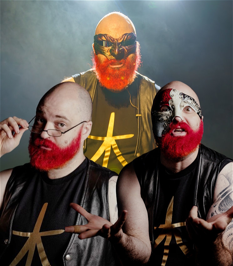 A composite image of a bald man with a bright red beard, shown in three different personas. He wears a black leather vest and a black shirt with a gold star-like symbol.

Left: He peers over small glasses with a thoughtful expression.
Right: He looks bewildered, wearing a silver and black half-mask.
Center: Larger and more dramatic, he stands confidently with a gold and black full-face mask resembling a mythical creature.